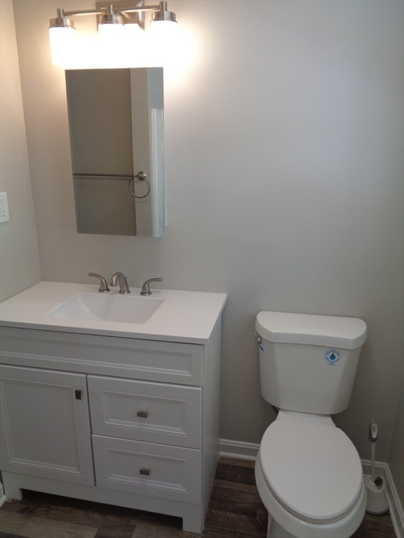 33 Hally Road Lowell, MA 01854 - Photo 12 of 19 a bathroom with a toilet sink and mirror