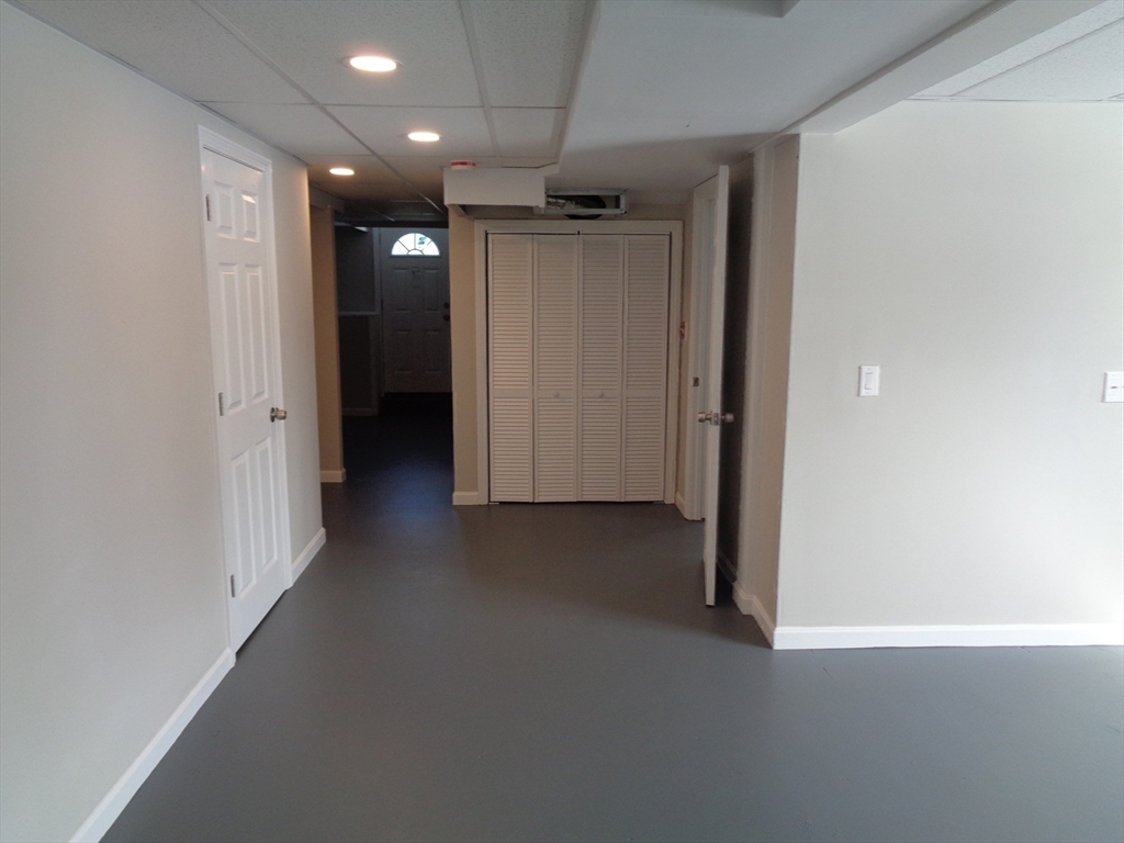 33 Hally Road Lowell, MA 01854 - Photo 17 of 19 an empty room with closet and a hallway