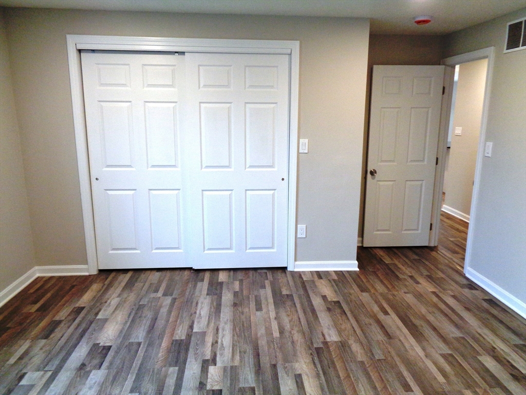 33 Hally Road Lowell, MA 01854 - Photo 8 of 19 a view of room with wooden floor
