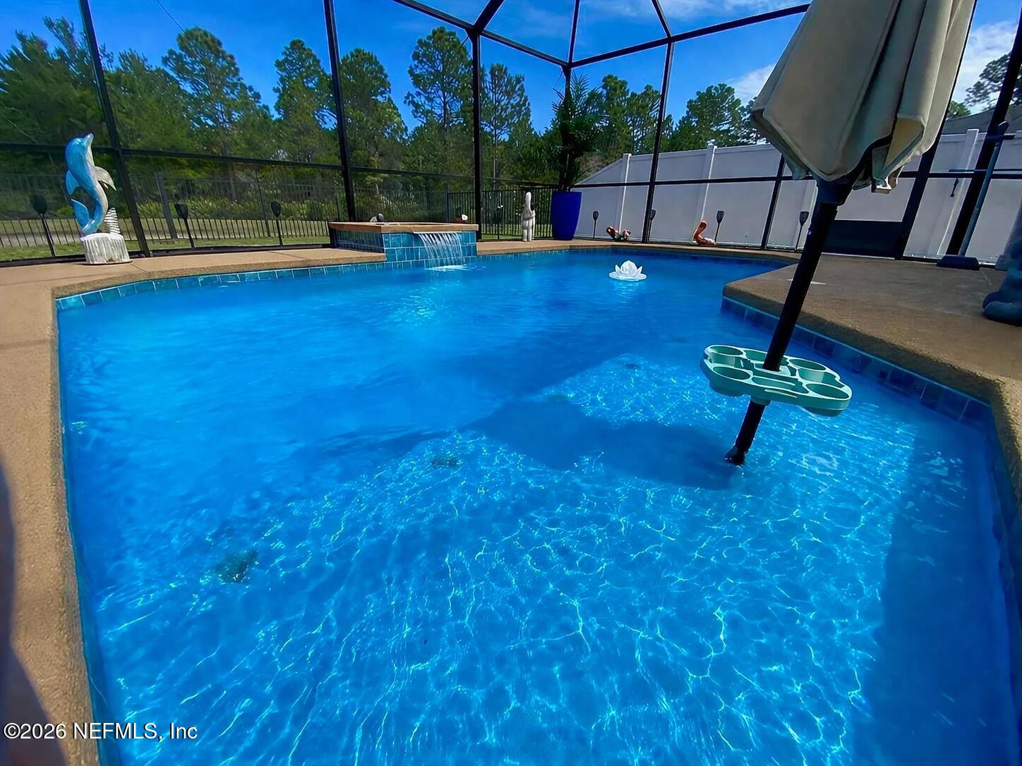 115 Sierras Loop St. Augustine, FL 32086 - Photo 49 of 65 a view of a swimming pool with a bench in the patio