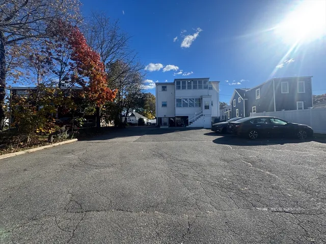 a view of street with parked cars