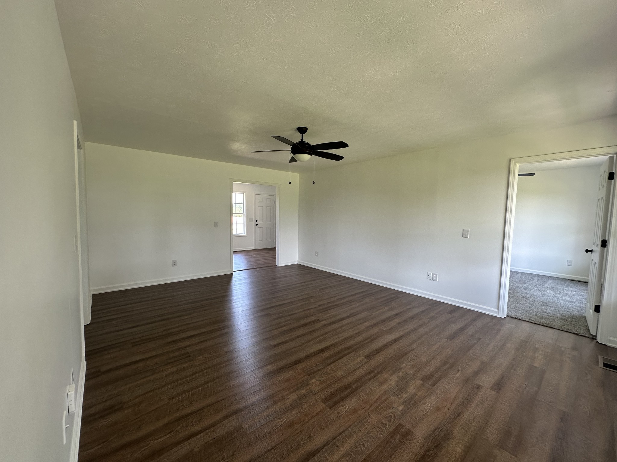 601 Lear Road Portland, TN 37148 - Photo 8 of 20 an empty room with wooden floor and windows