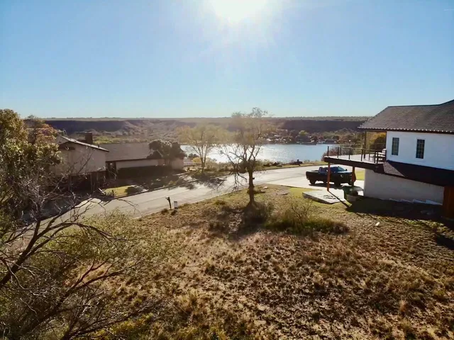 a view of a town with big trees
