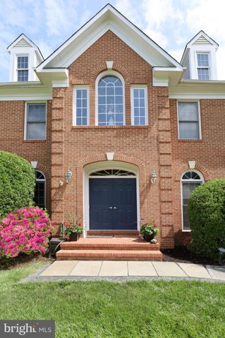 a view of entryway livingroom and hall with wooden floor
