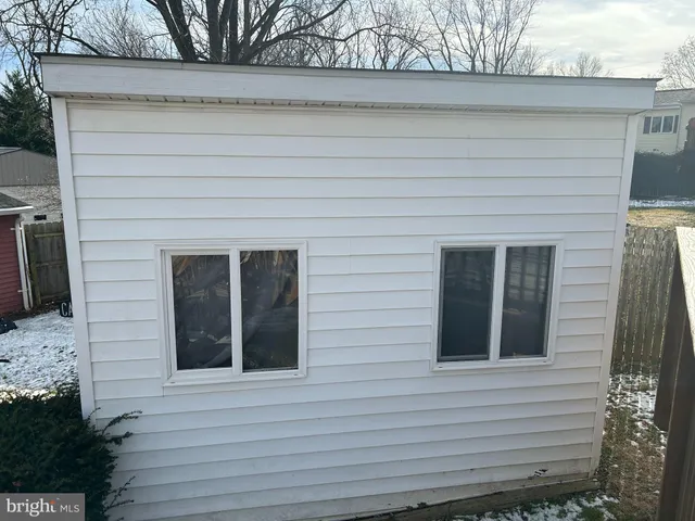 a view of a white house with a large windows