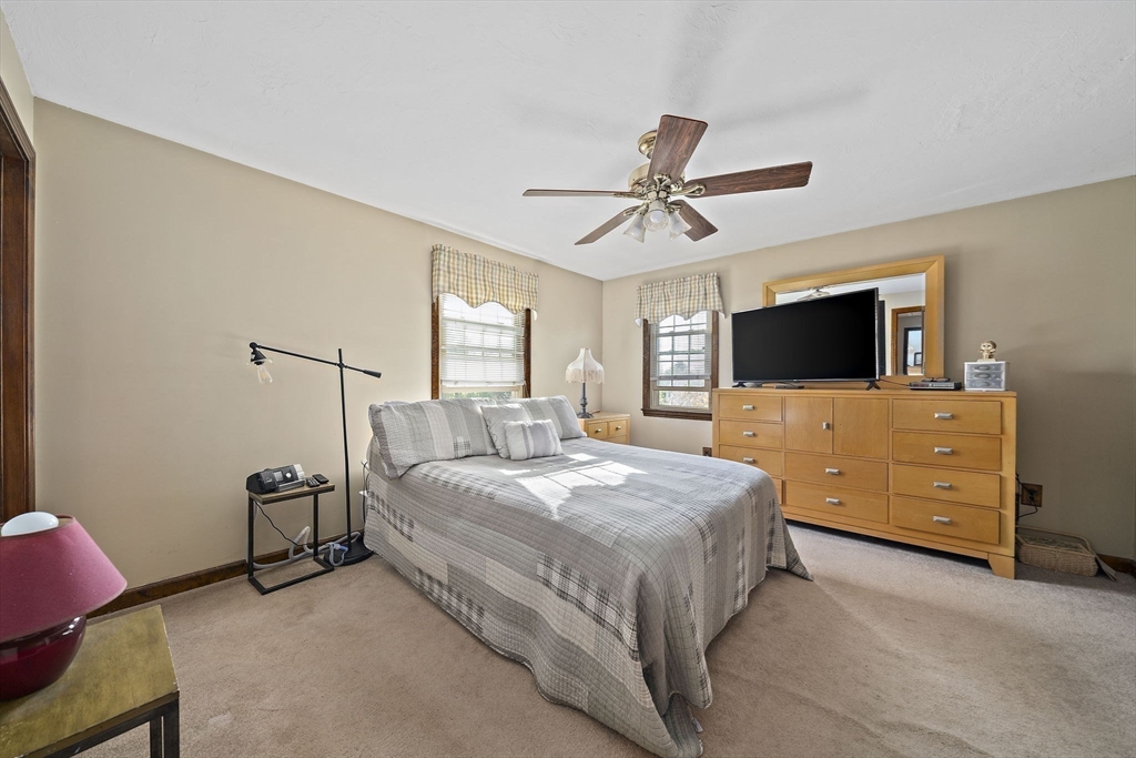 164 Hancock Street Abington, MA 02351 - Photo 14 of 42 a bedroom with a bed and a flat screen tv