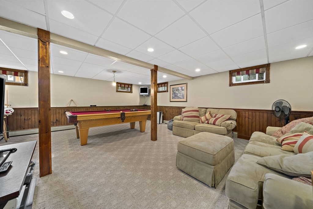 164 Hancock Street Abington, MA 02351 - Photo 21 of 42 a living room with furniture and a table