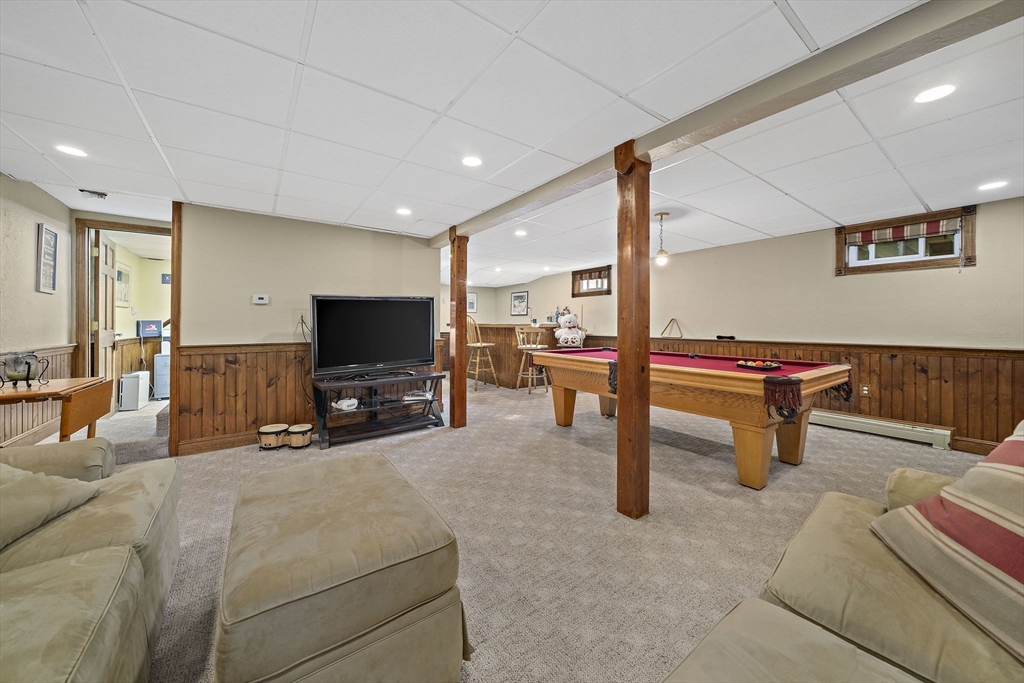 164 Hancock Street Abington, MA 02351 - Photo 22 of 42 a living room with furniture and a flat screen tv