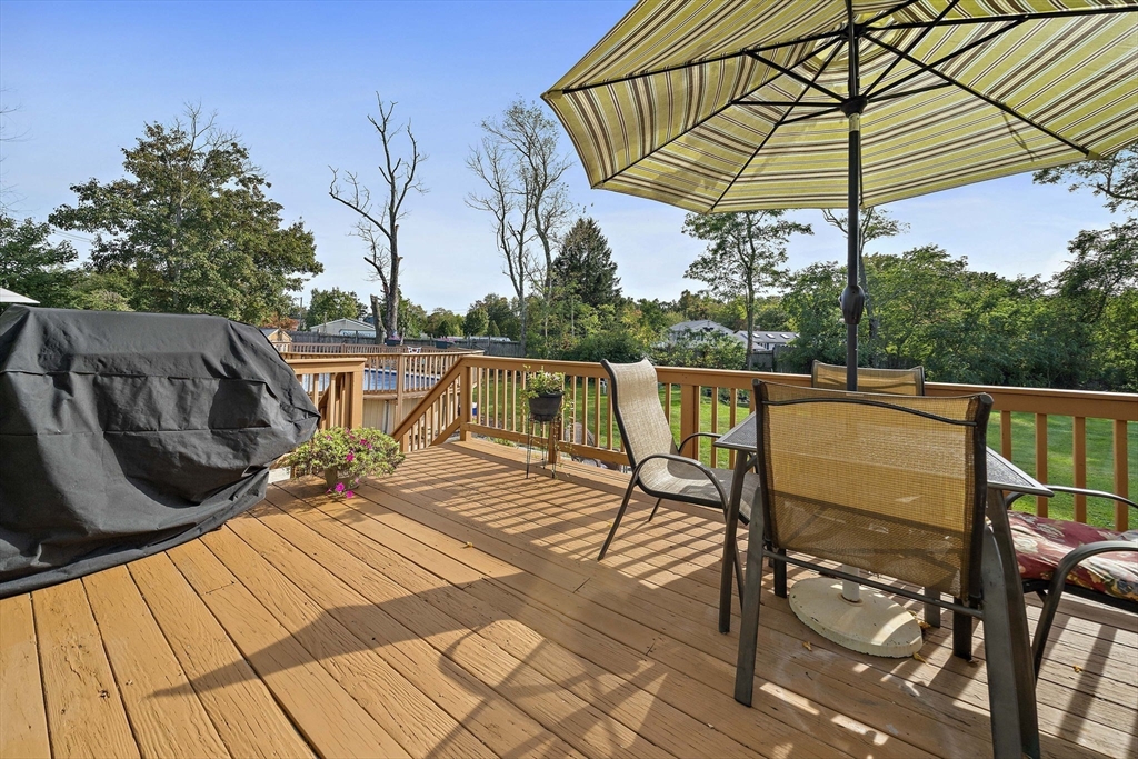 164 Hancock Street Abington, MA 02351 - Photo 28 of 42 a view of a balcony with chairs and wooden floor