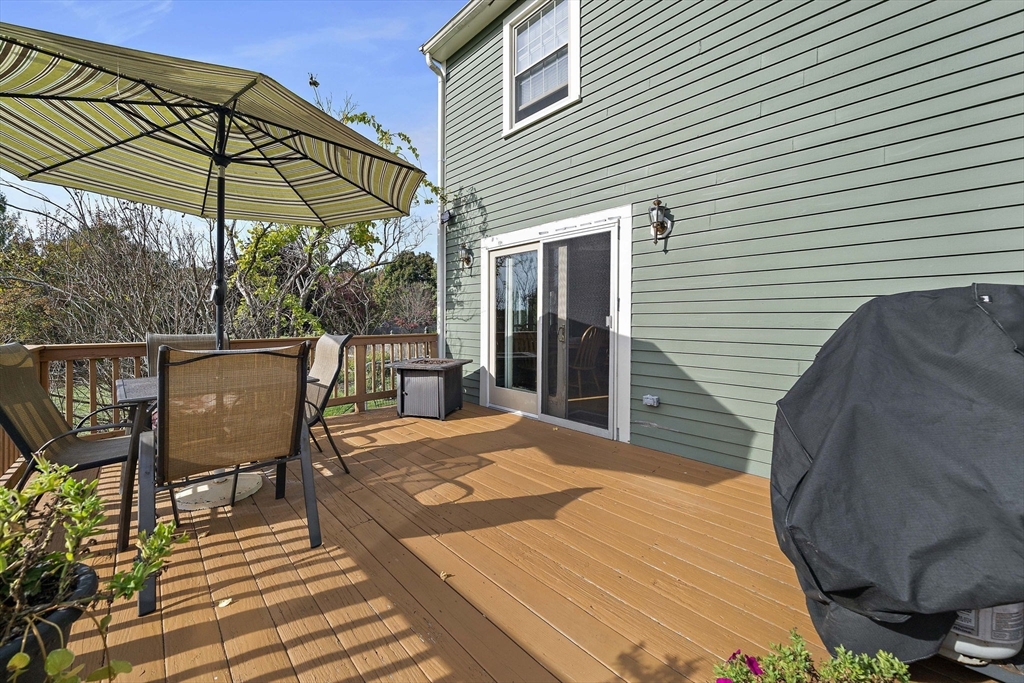 164 Hancock Street Abington, MA 02351 - Photo 29 of 42 a patio with wooden floor and outdoor seating