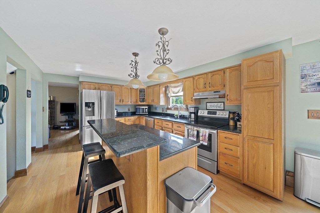 164 Hancock Street Abington, MA 02351 - Photo 6 of 42 a kitchen with stainless steel appliances granite countertop a stove and a refrigerator