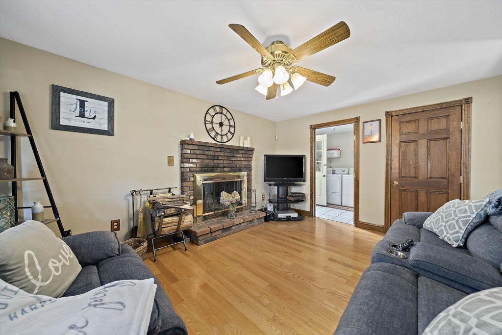 164 Hancock Street Abington, MA 02351 - Photo 9 of 42 a living room with furniture a couch and a flat screen tv