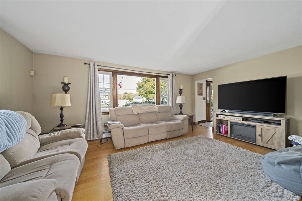 164 Hancock Street Abington, MA 02351 - Photo 10 of 42 a living room with furniture and a flat screen tv