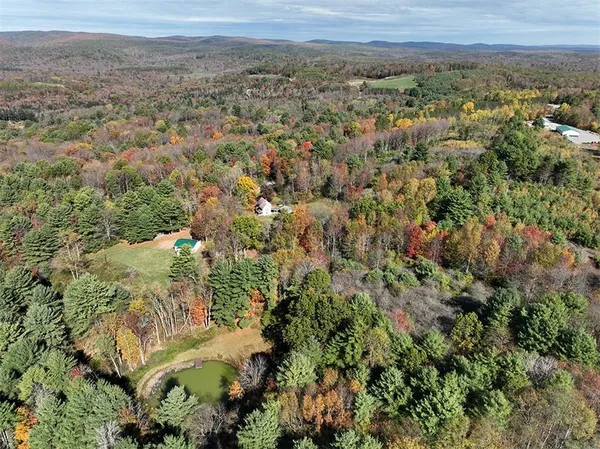 a view of a city with green field