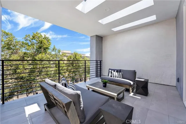 a view of balcony with furniture