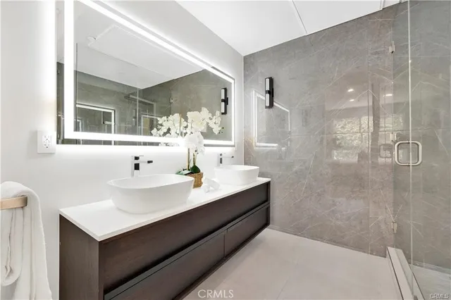 a bathroom with a sink and mirror