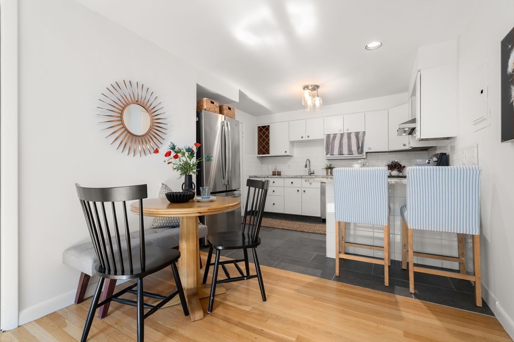 205 Kent Street, Unit 48 Brookline, MA 02446 - Photo 2 of 10 a view of kitchen with cabinets and wooden floor