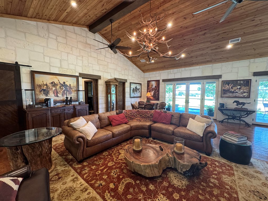 772 Luckenbach Road Fredericksburg, TX 78624 - Photo 16 of 87 a living room with furniture and a large window