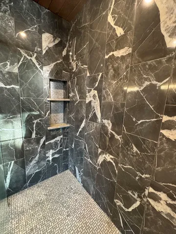 a bedroom with a bed and furniture