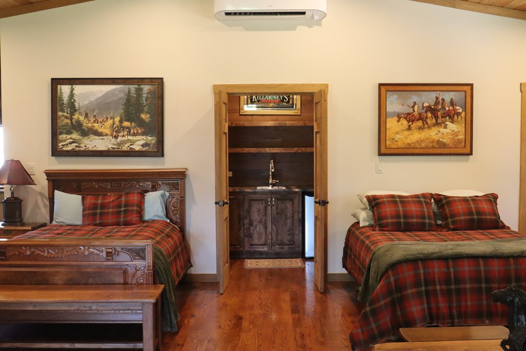 772 Luckenbach Road Fredericksburg, TX 78624 - Photo 51 of 87 a bedroom with a bed and furniture