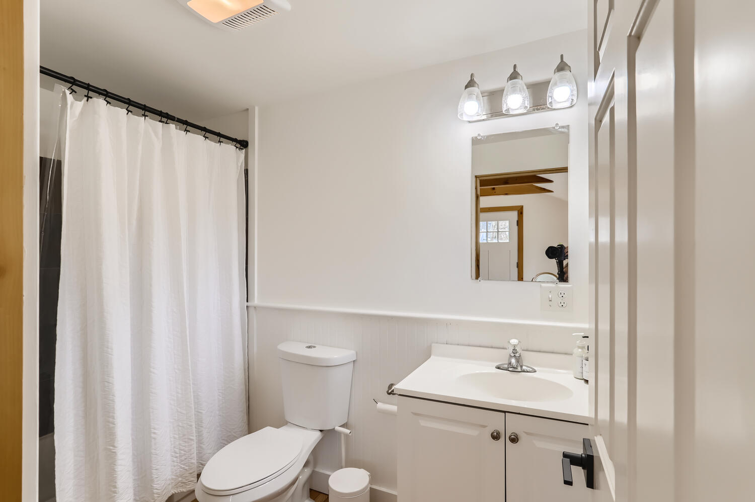 95 Summer Street Vineyard Haven, MA 02568 - Photo 12 of 23 a bathroom with a sink a toilet and mirror