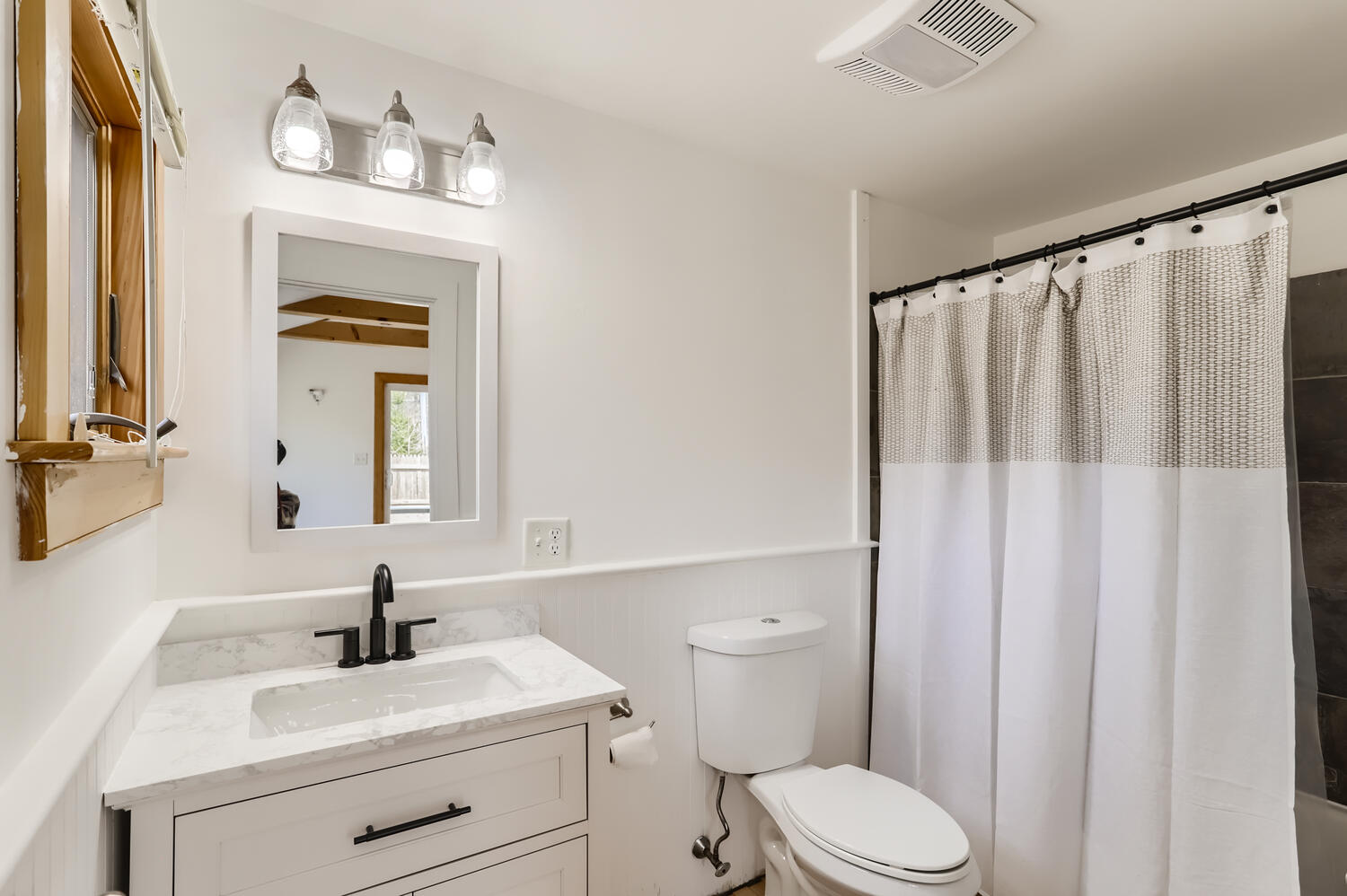 95 Summer Street Vineyard Haven, MA 02568 - Photo 16 of 23 a bathroom with a sink vanity mirror and toilet