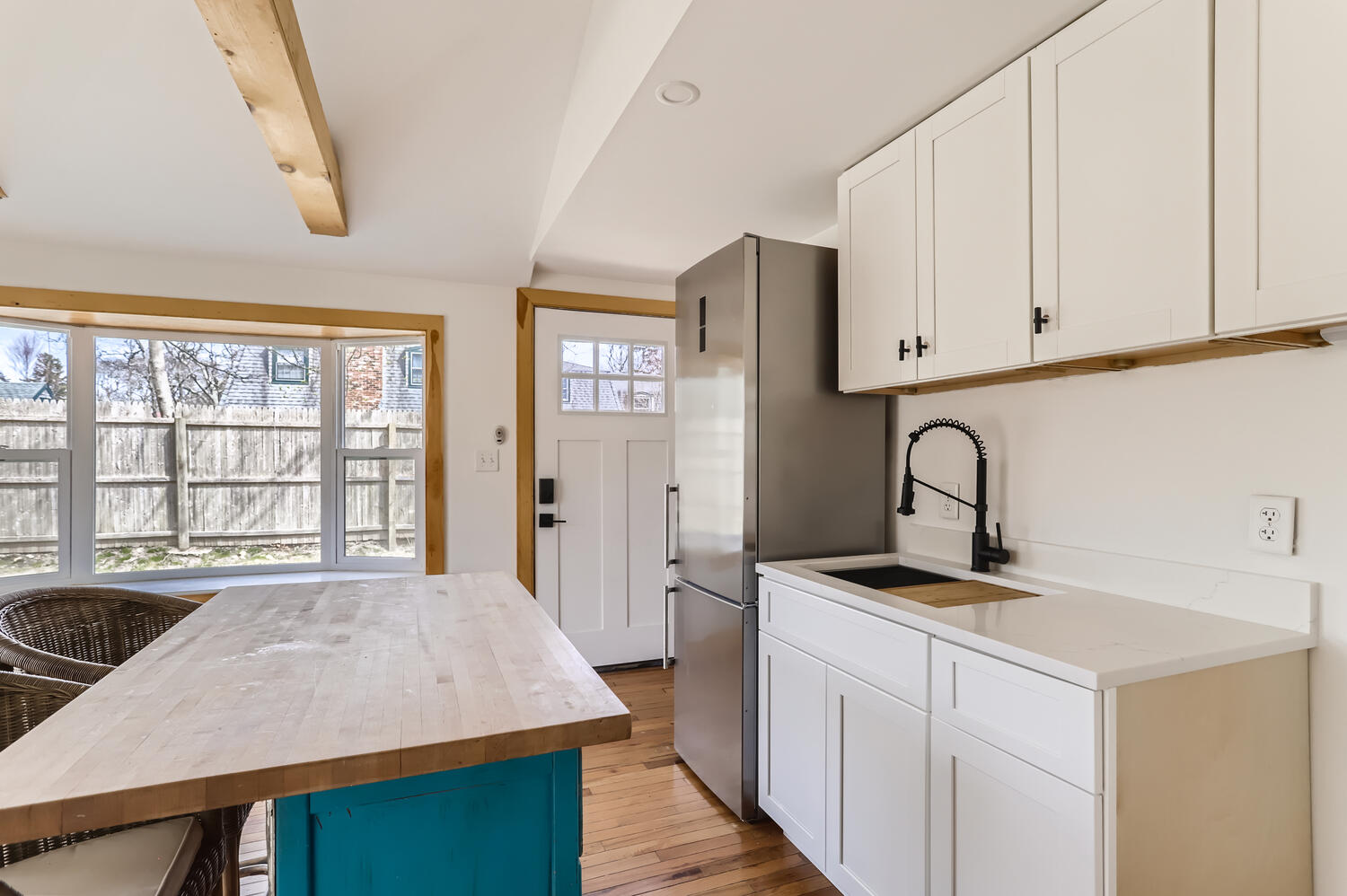 95 Summer Street Vineyard Haven, MA 02568 - Photo 21 of 23 a view of a kitchen with sink dishwasher and wooden floor