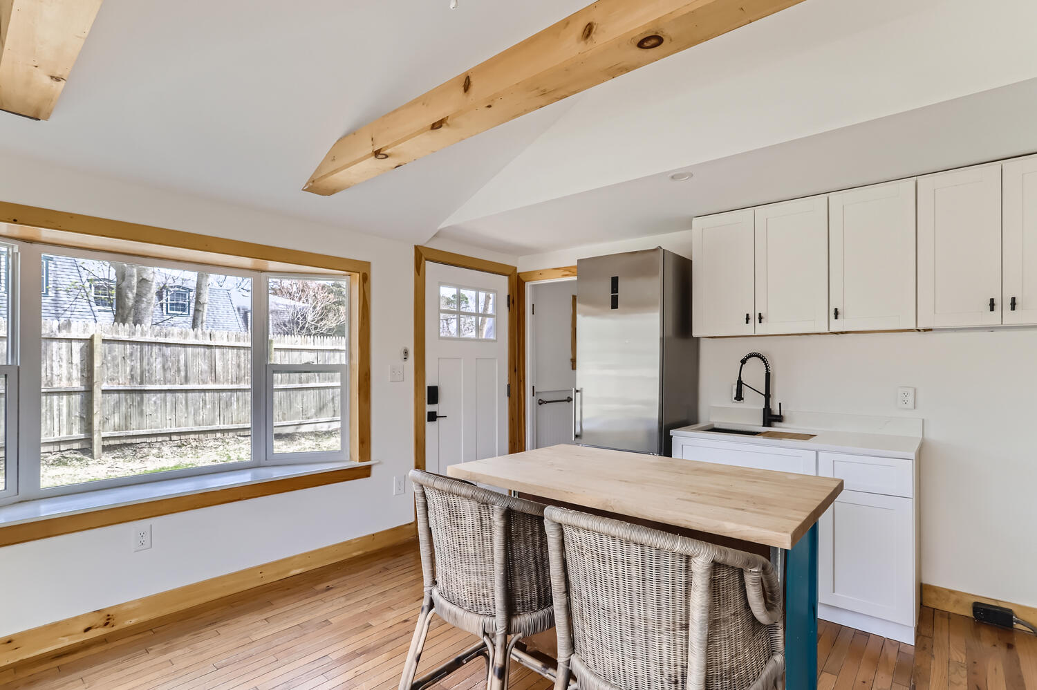 95 Summer Street Vineyard Haven, MA 02568 - Photo 22 of 23 a view of a dining room with furniture and wooden floor