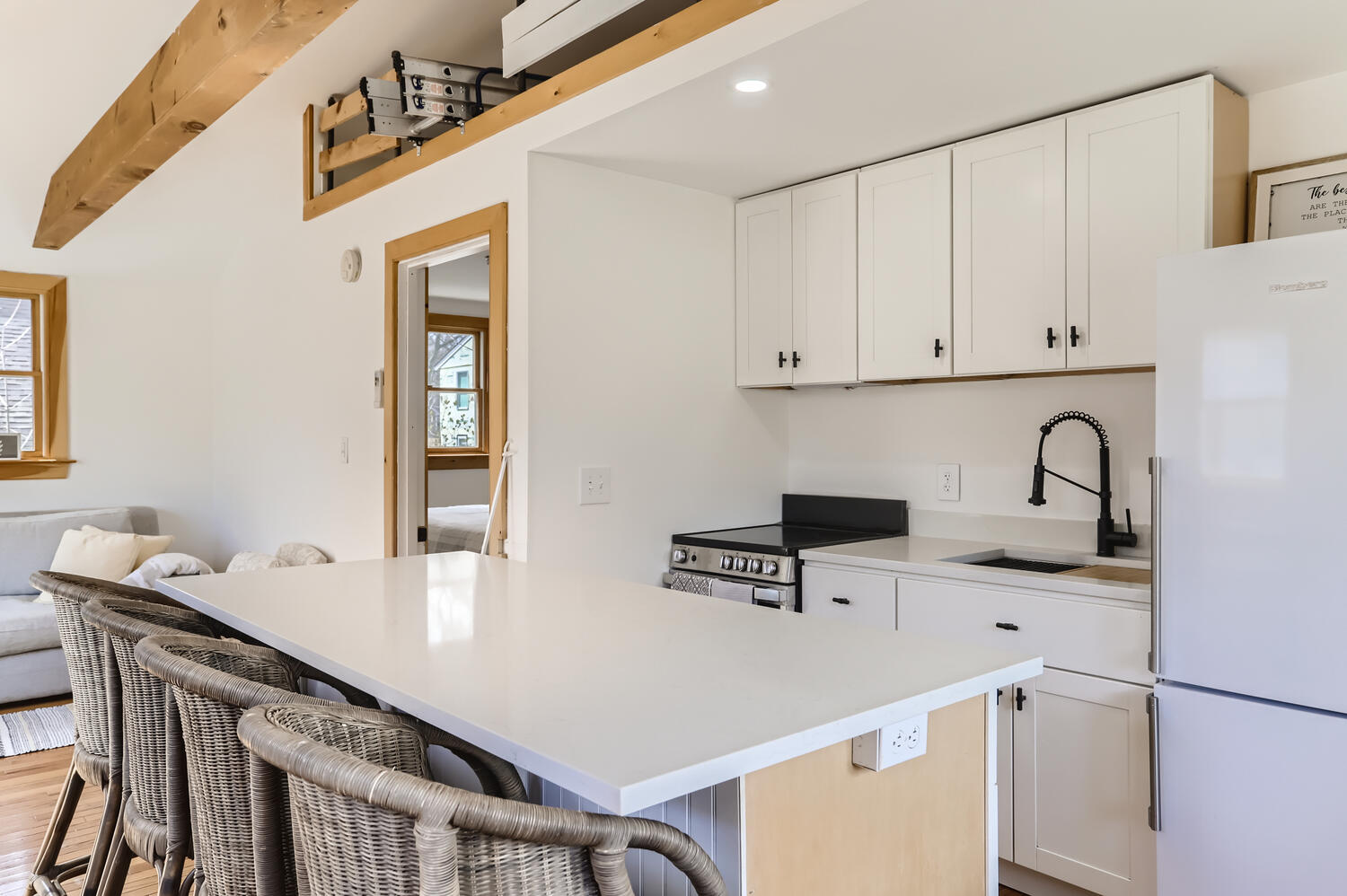 95 Summer Street Vineyard Haven, MA 02568 - Photo 9 of 23 a kitchen with stainless steel appliances a sink a stove a refrigerator a table and chairs