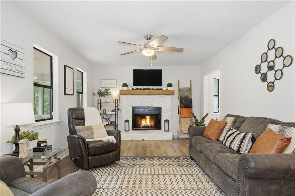 404 Brooks Street Dallas, GA 30157 - Photo 3 of 38 a living room with furniture and a fireplace