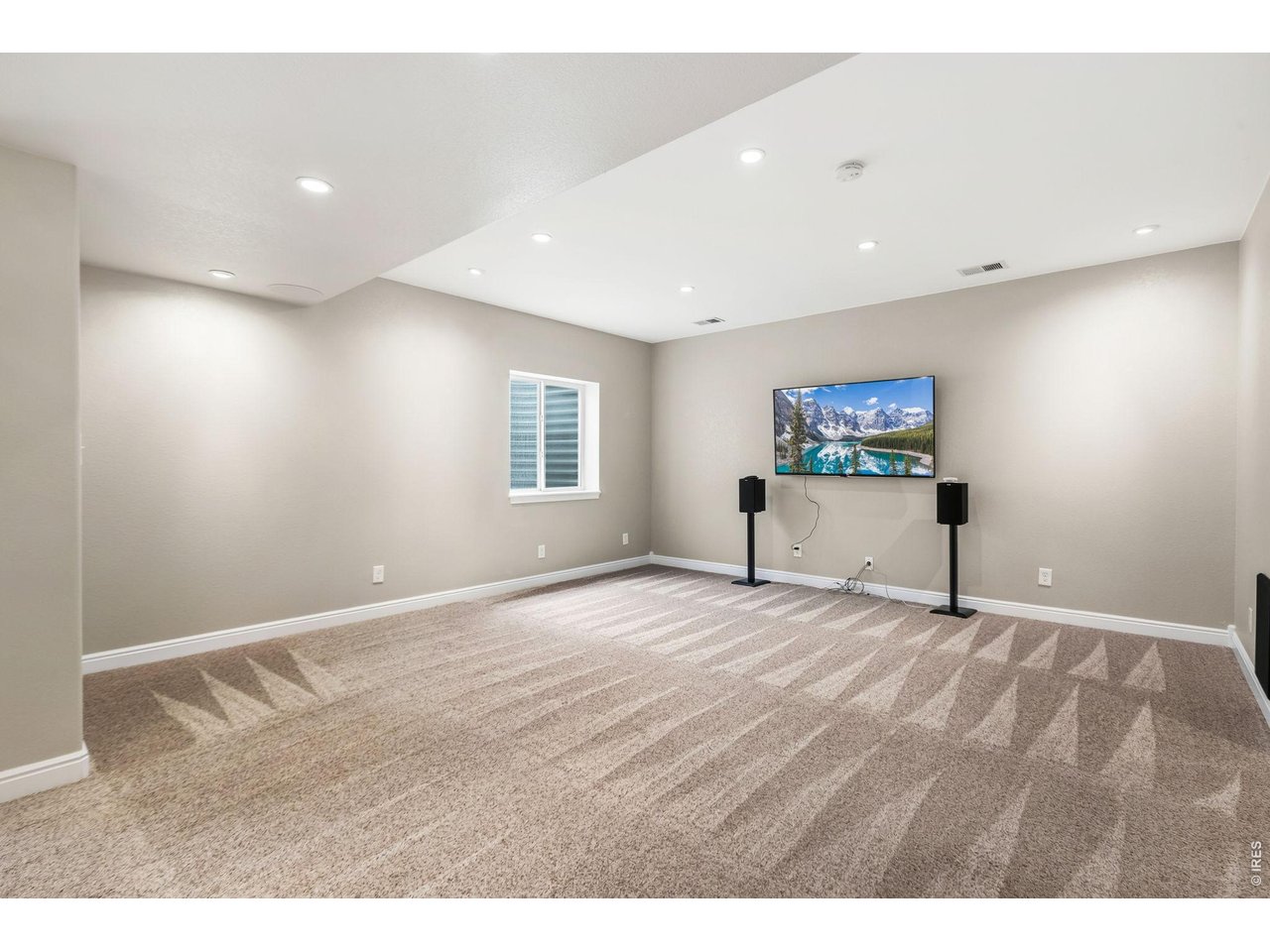 600 Botley Drive Windsor, CO 80550 - Photo 34 of 40 Basement Family Room - TV and Surround Sound system included!