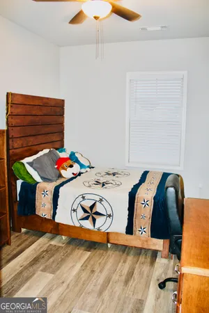 a bedroom with a bed and a table