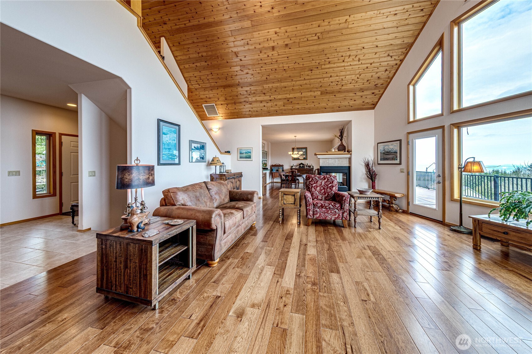 273 Harbor Heights Road Port Angeles, WA 98362 - Photo 13 of 40 a living room with furniture and a wooden floor