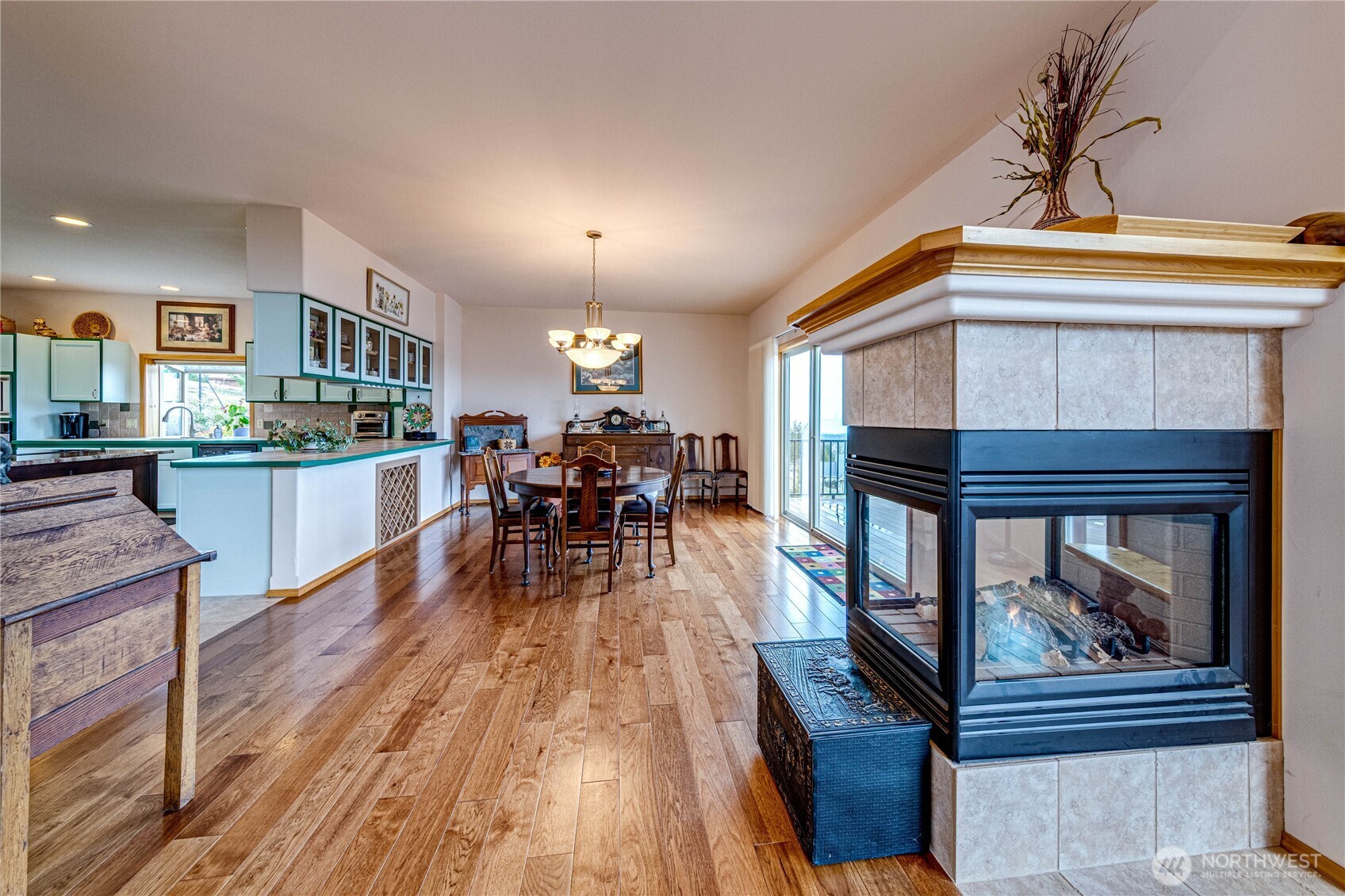 273 Harbor Heights Road Port Angeles, WA 98362 - Photo 18 of 40 a living room with furniture and a wooden floor