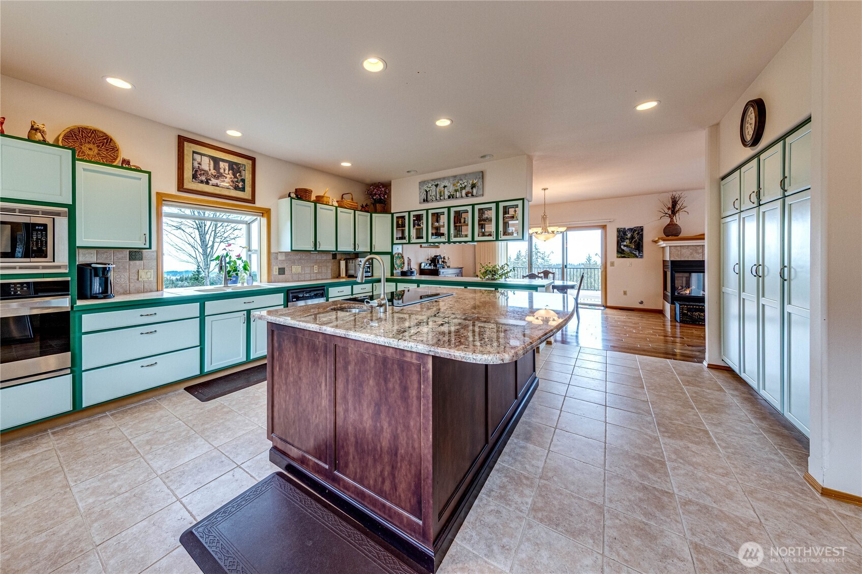 273 Harbor Heights Road Port Angeles, WA 98362 - Photo 20 of 40 a kitchen with stainless steel appliances granite countertop a stove and a refrigerator