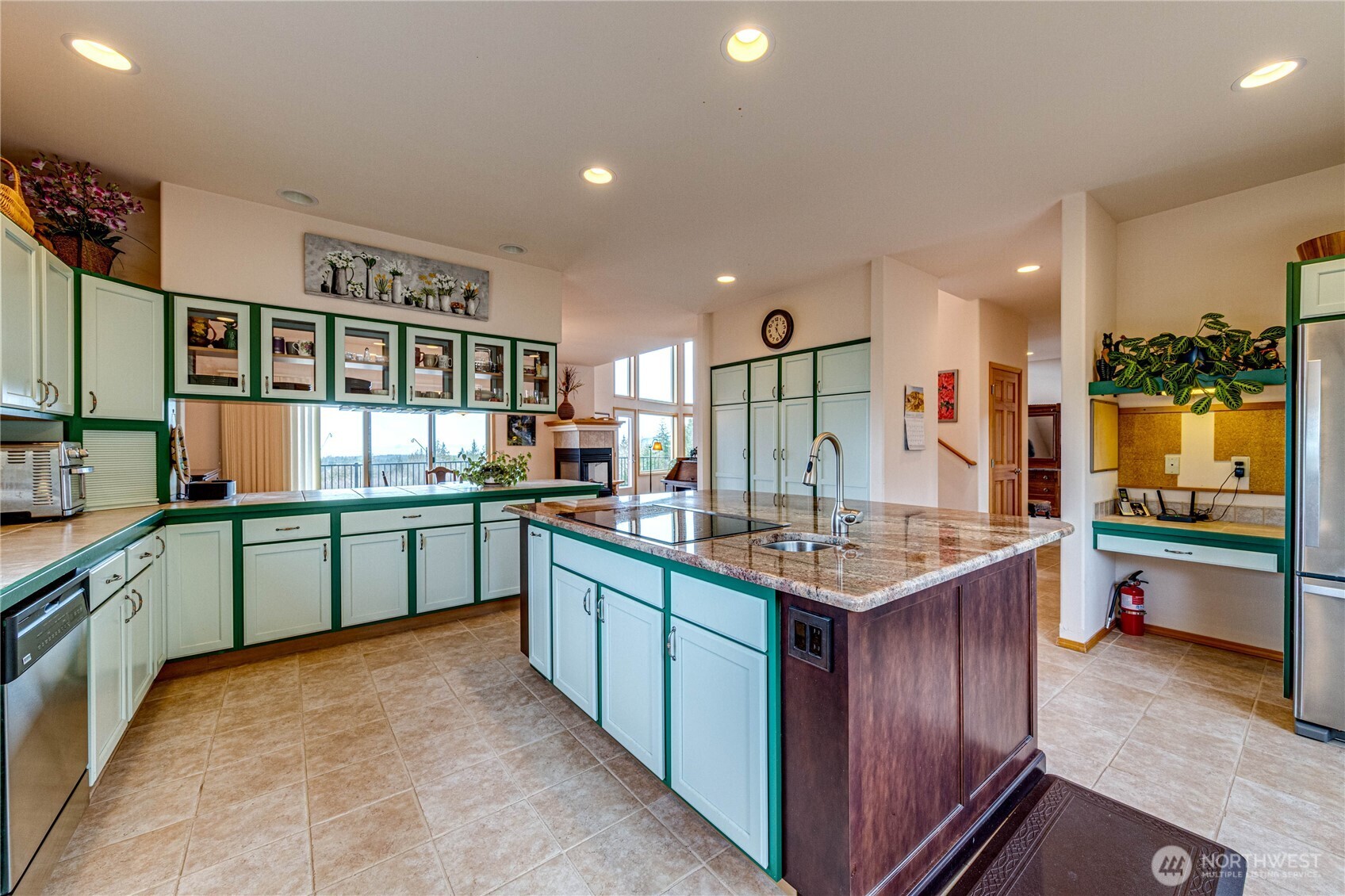 273 Harbor Heights Road Port Angeles, WA 98362 - Photo 21 of 40 a kitchen with stainless steel appliances granite countertop a sink and cabinets