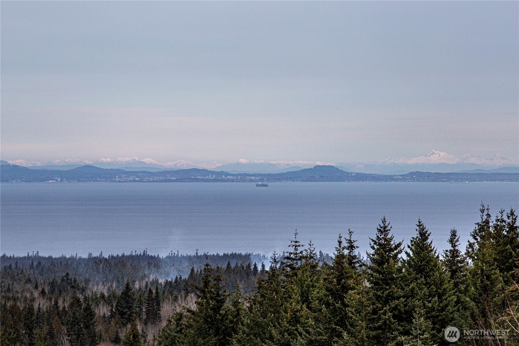 273 Harbor Heights Road Port Angeles, WA 98362 - Photo 25 of 40 a view of a lake and mountain in the back