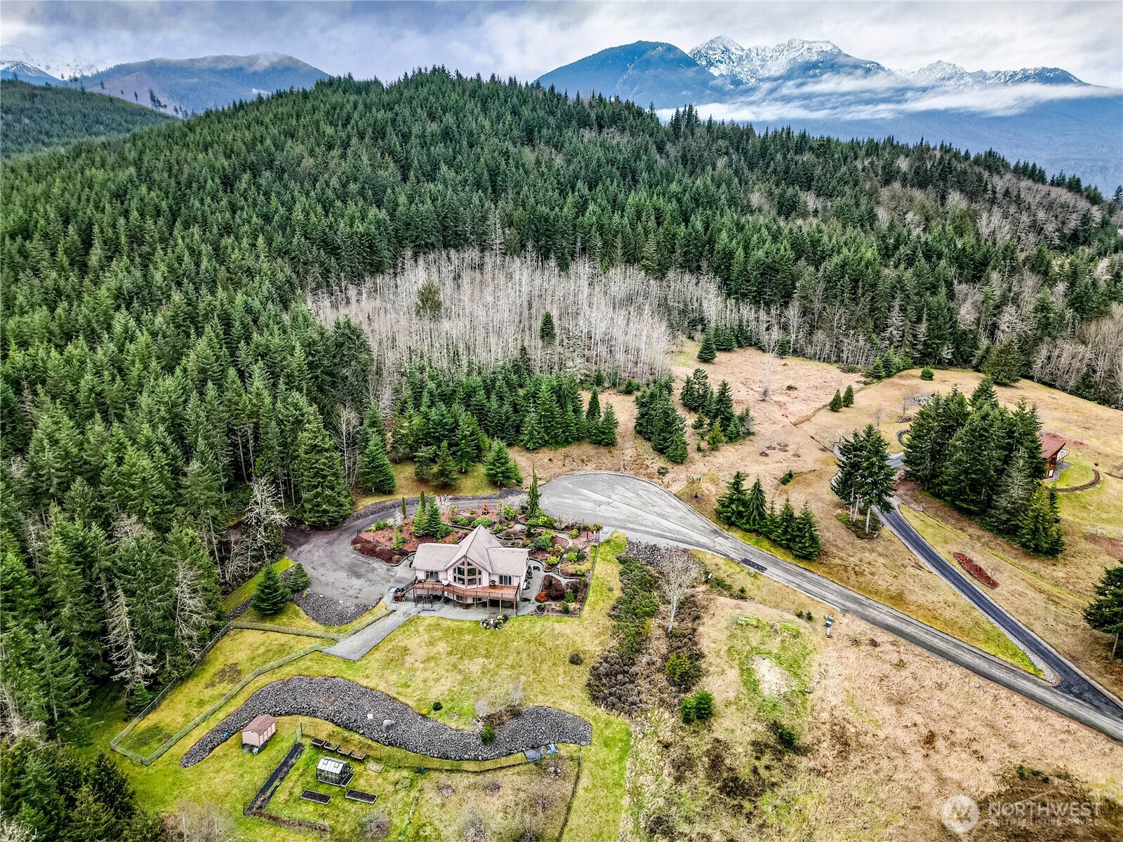 273 Harbor Heights Road Port Angeles, WA 98362 - Photo 39 of 40 a view of swimming pool with a yard and mountain view