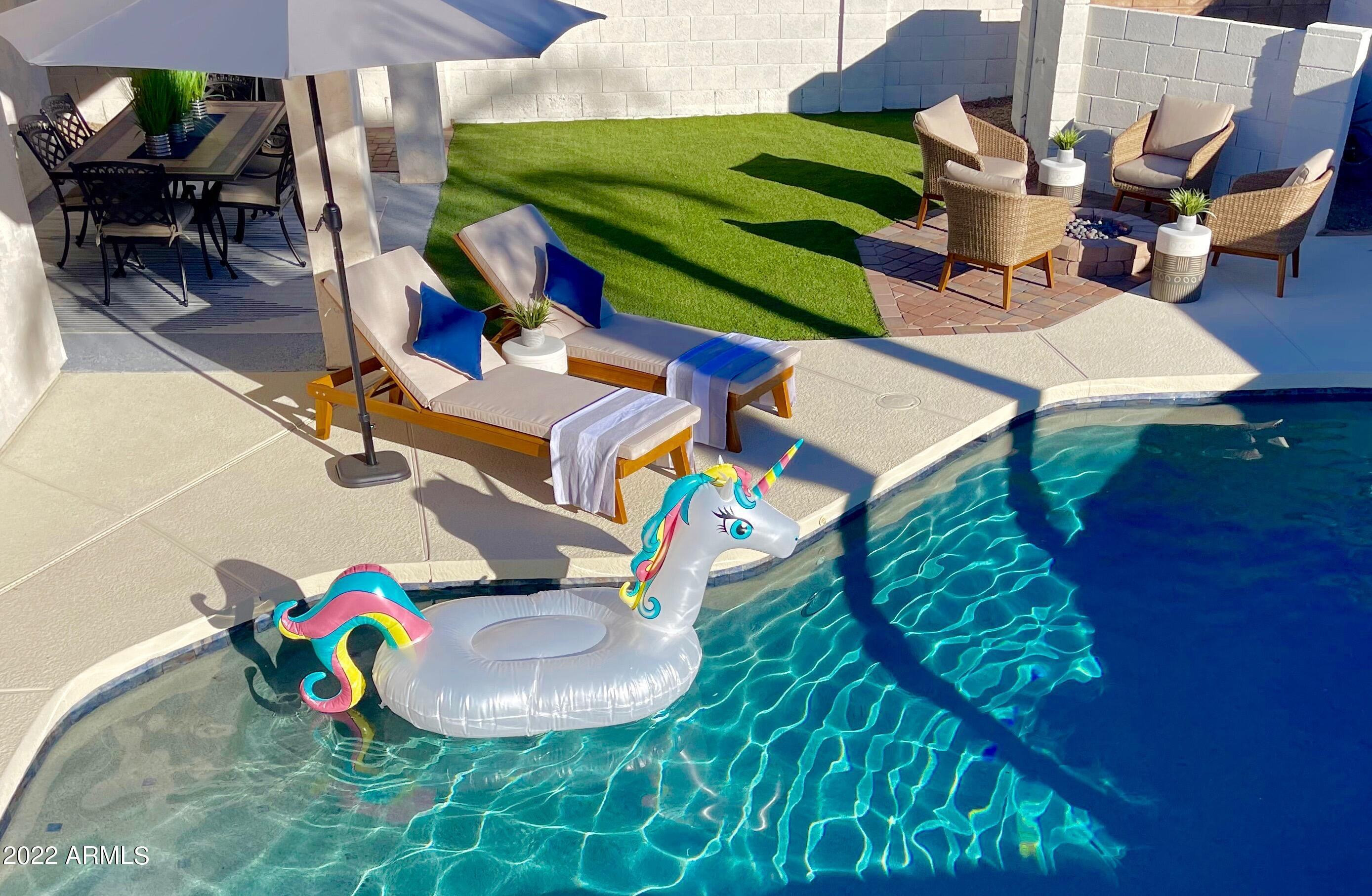 8661 East Gail Road Scottsdale, AZ 85260 - Photo 13 of 49 an aerial view of a chairs and table with umbrella in the patio