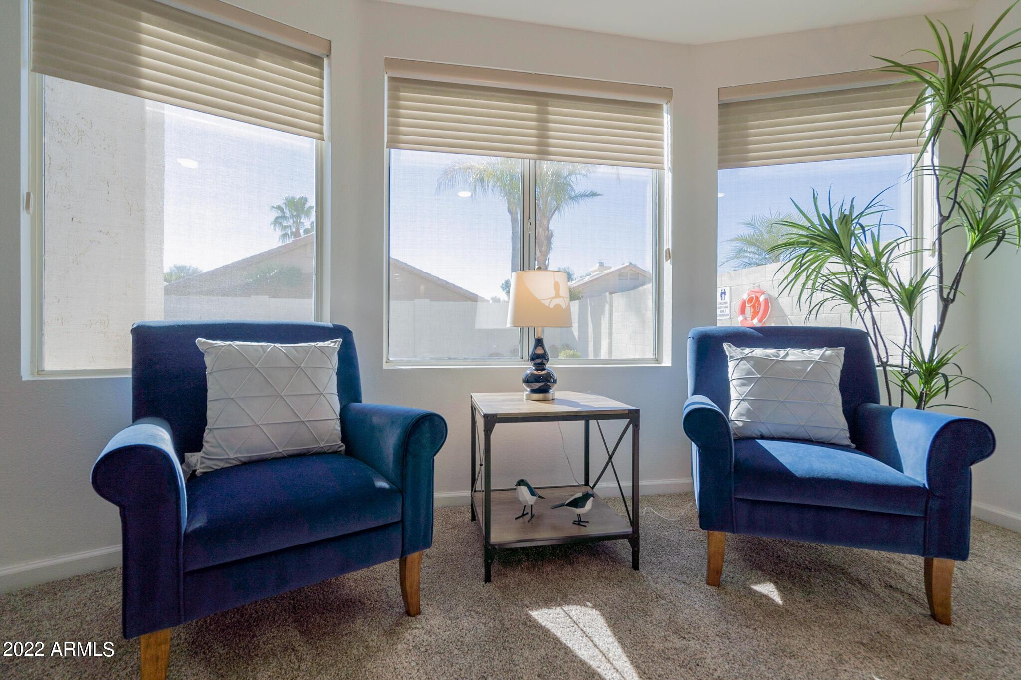 8661 East Gail Road Scottsdale, AZ 85260 - Photo 29 of 49 a living room with furniture and a large window