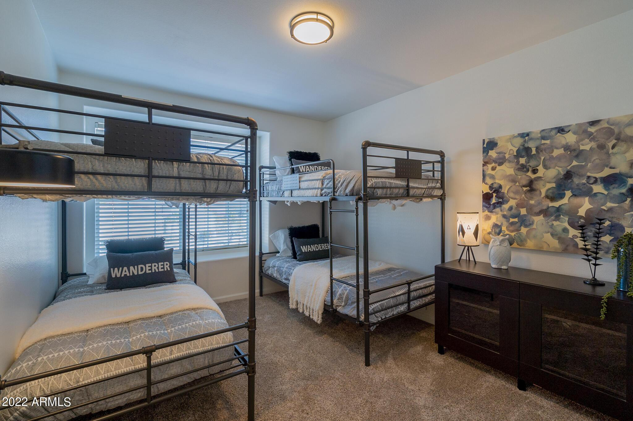 8661 East Gail Road Scottsdale, AZ 85260 - Photo 46 of 49 a bedroom with bed and windows
