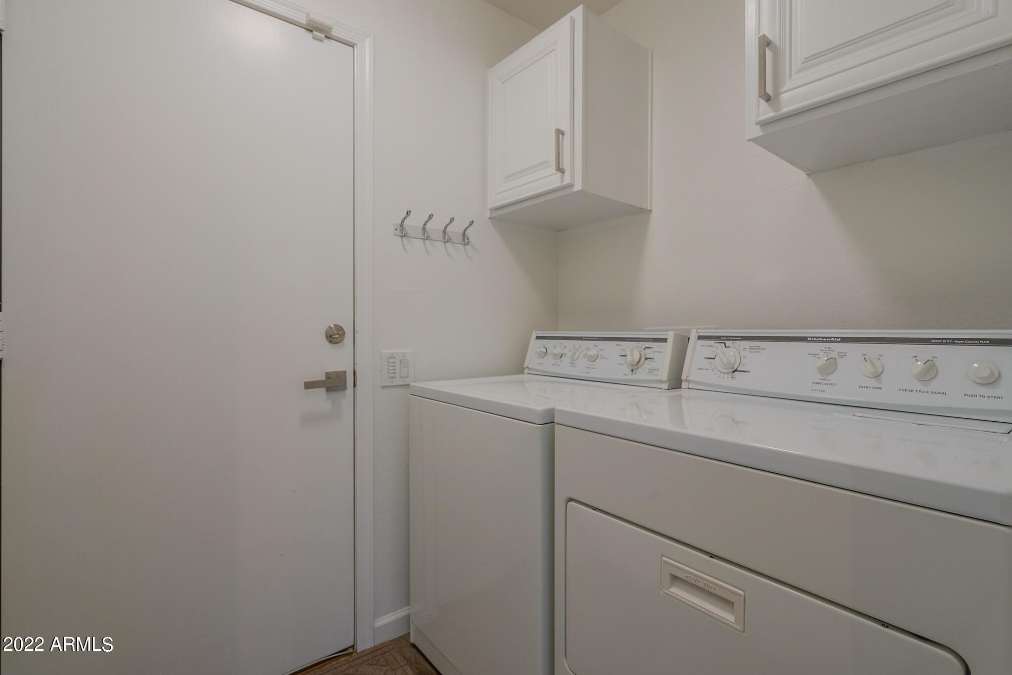 8661 East Gail Road Scottsdale, AZ 85260 - Photo 47 of 49 a view of storage and utility room with washer and dryer