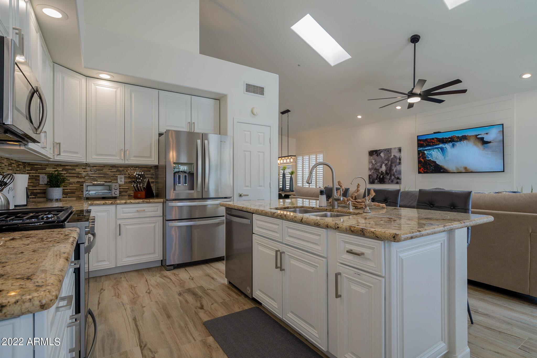 8661 East Gail Road Scottsdale, AZ 85260 - Photo 10 of 49 a kitchen with a sink stove and refrigerator