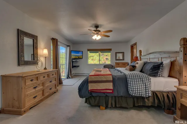 a bedroom with bed and window