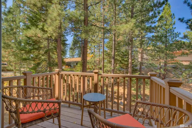 a view of a chairs and table on the deck