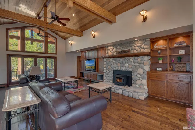 a living room with furniture fireplace and flat screen tv