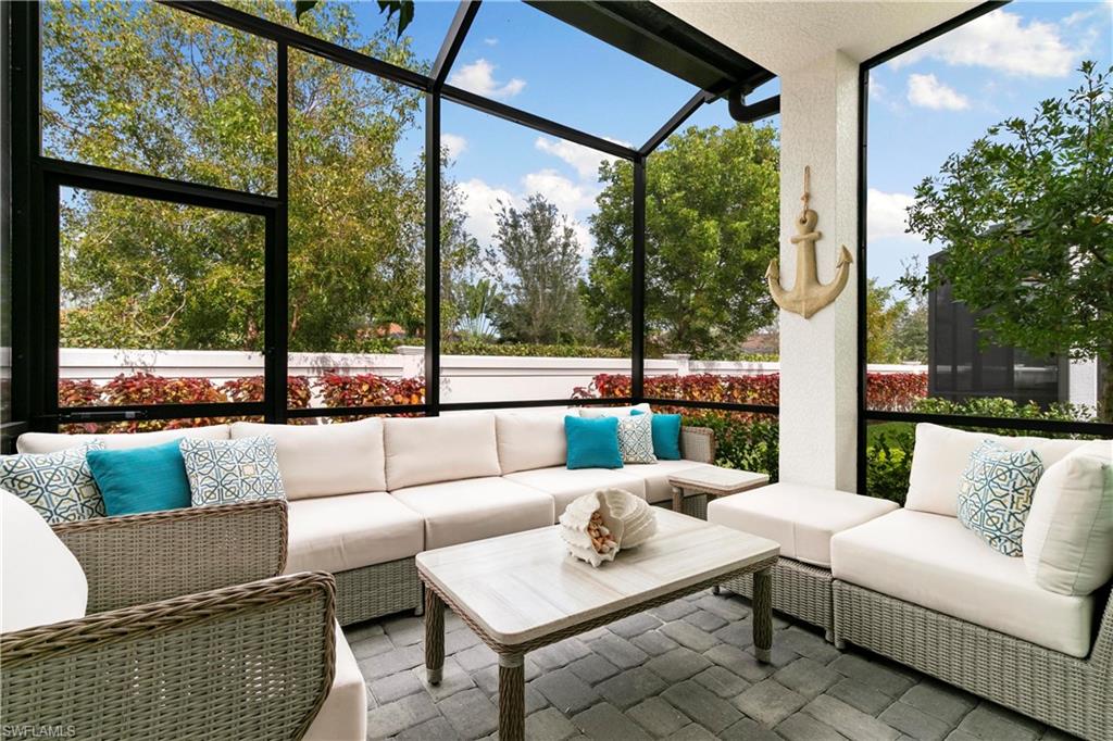 7578 Rockefeller Drive Naples, FL 34119 - Photo 19 of 39 a balcony with furniture and a couch