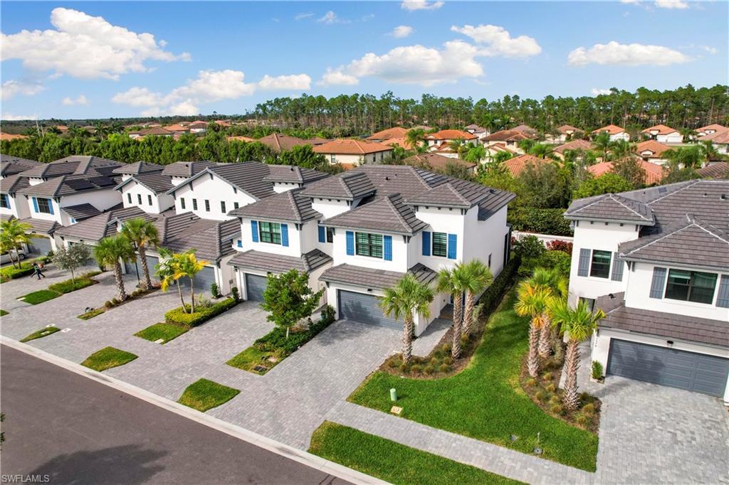 7578 Rockefeller Drive Naples, FL 34119 - Photo 2 of 39 an aerial view of residential houses with yard