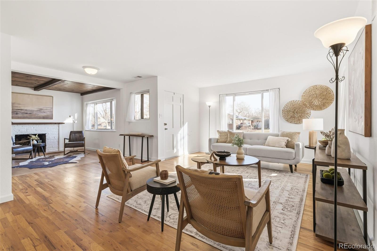 4535 Zephyr Street Wheat Ridge, CO 80033 - Photo 12 of 35 a living room with fireplace furniture and a wooden floor