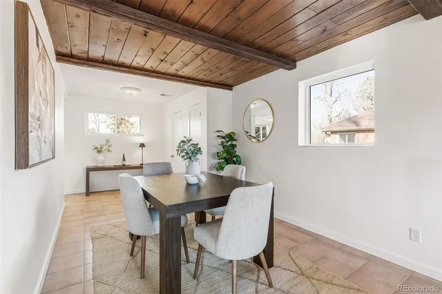 a view of a dining room with furniture and window